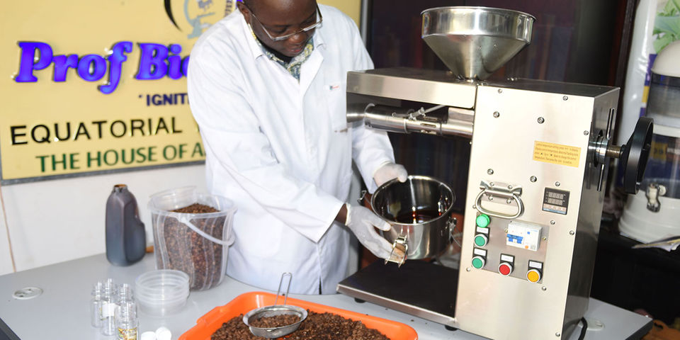 Professor Nyanzi displays the coffee oil extracted out of the coffee beans at his plant in Masanafu. Photo / Monitor