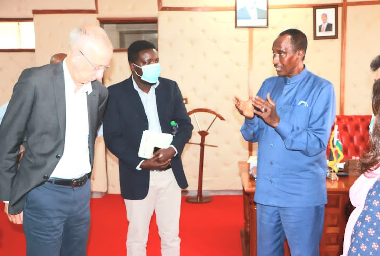 Officials from the UK's Special Envoy for Famine Prevention and Humanitarian Affairs hold discussions with Wajir governor Mohamed Abdi at his office on Monday, July 18.